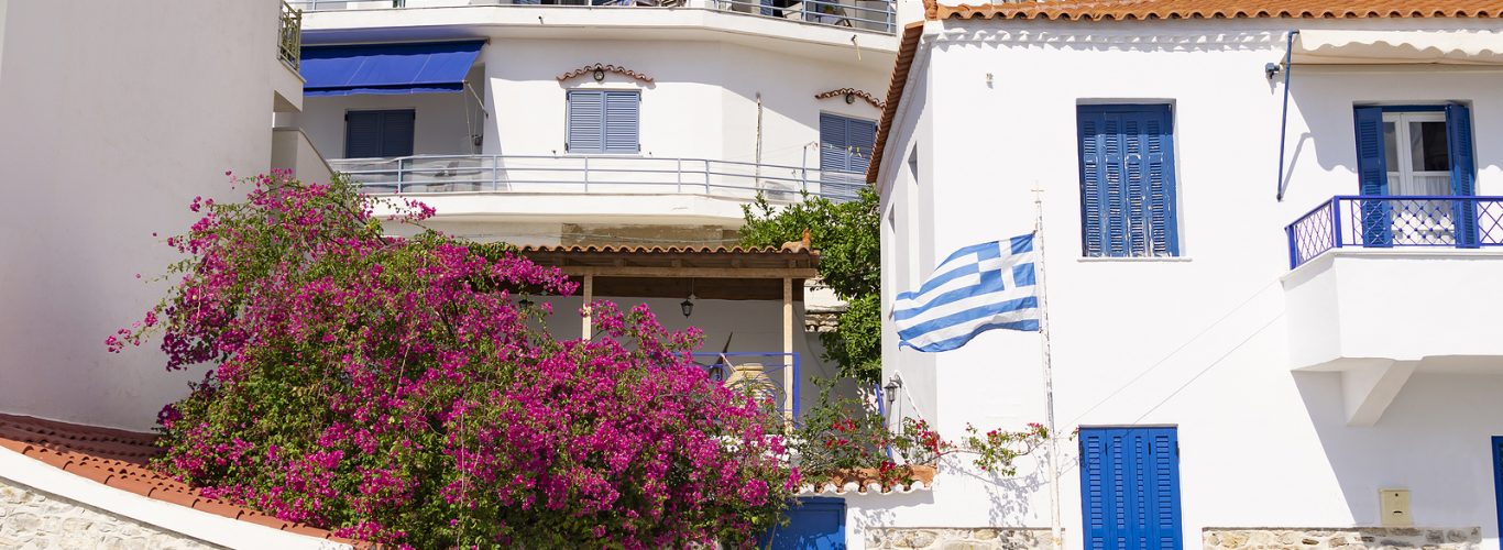 Typical White Walls And Blue Windows Of Greek Mediterranean Buil