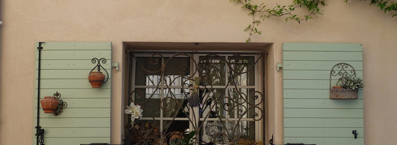 Window With Green Shutters And Window Pottery Box With Flowers