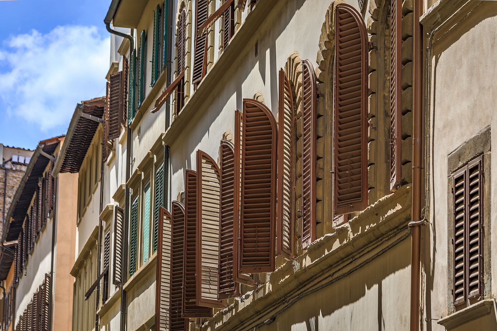 Arched Wooden Shutters On A Building Near Santa Croce Basilica,