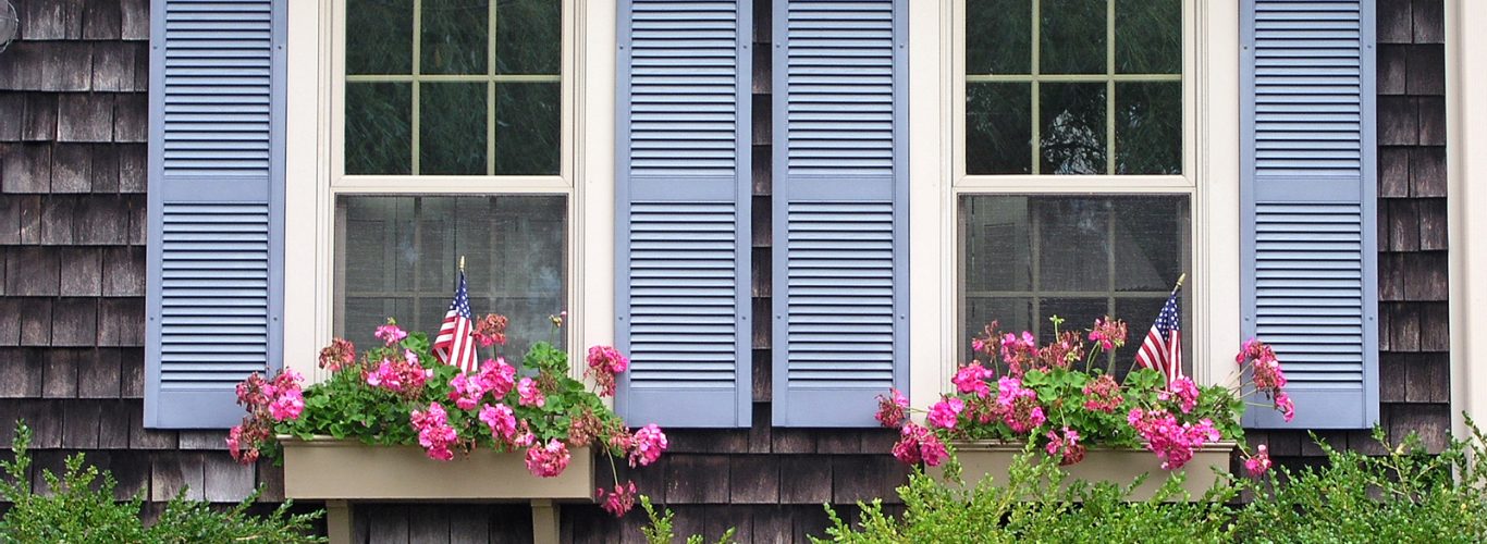 Wooden window shutters-blue shutters on a cape