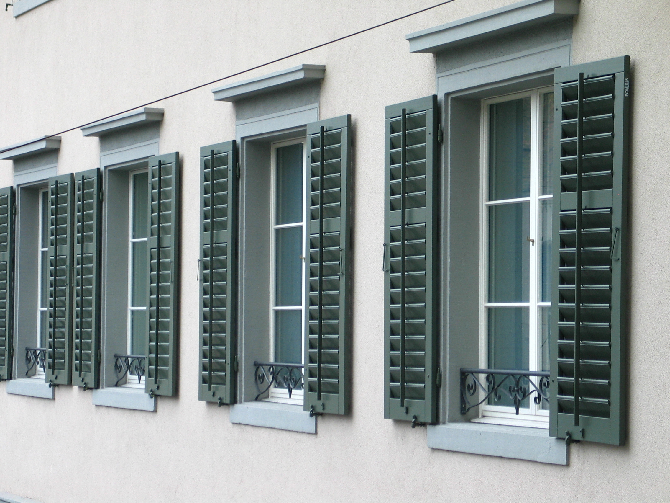 Panel Shutters Brighton - windows with shutters open