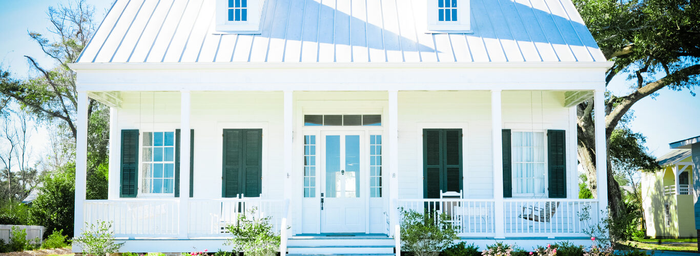 Full Height Shutters Brighton - white beach cottage with a metal roof